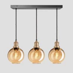 Brooklyn Tinted Glass Globe 3 Wire Cluster Lights - 7 Inch - Amber 14 Brooklyn Tinted Glass Globe 3 Wire Cluster Lights - 7 Inch - Amber -Lumi Home Shop 7 Inch Pendant Glass Industville Lighting Globe BrassHolder Brooklyn BR TGL GL7 3WCL A BH