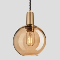 Sleek Tinted Glass Globe Pendant - 7 Inch - Amber -Lumi Home Shop 7 Inch Pendant Tinted Glass Amber Globe Brass Sleek SL TGL GLP7 A BH Lit