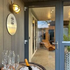 6 Inch Black Bulkhead Outdoor & Bathroom Oval Wall Light With Versatile Side & Rear Wiring Options -Lumi Home Shop BK IP65 OWL6 BK BW RB LR INDUSTVILLE B2C OUTDOORS CHAMPAGNE CHAMPAGNE FLUTE DOORS The Hideaway Retreat insitu